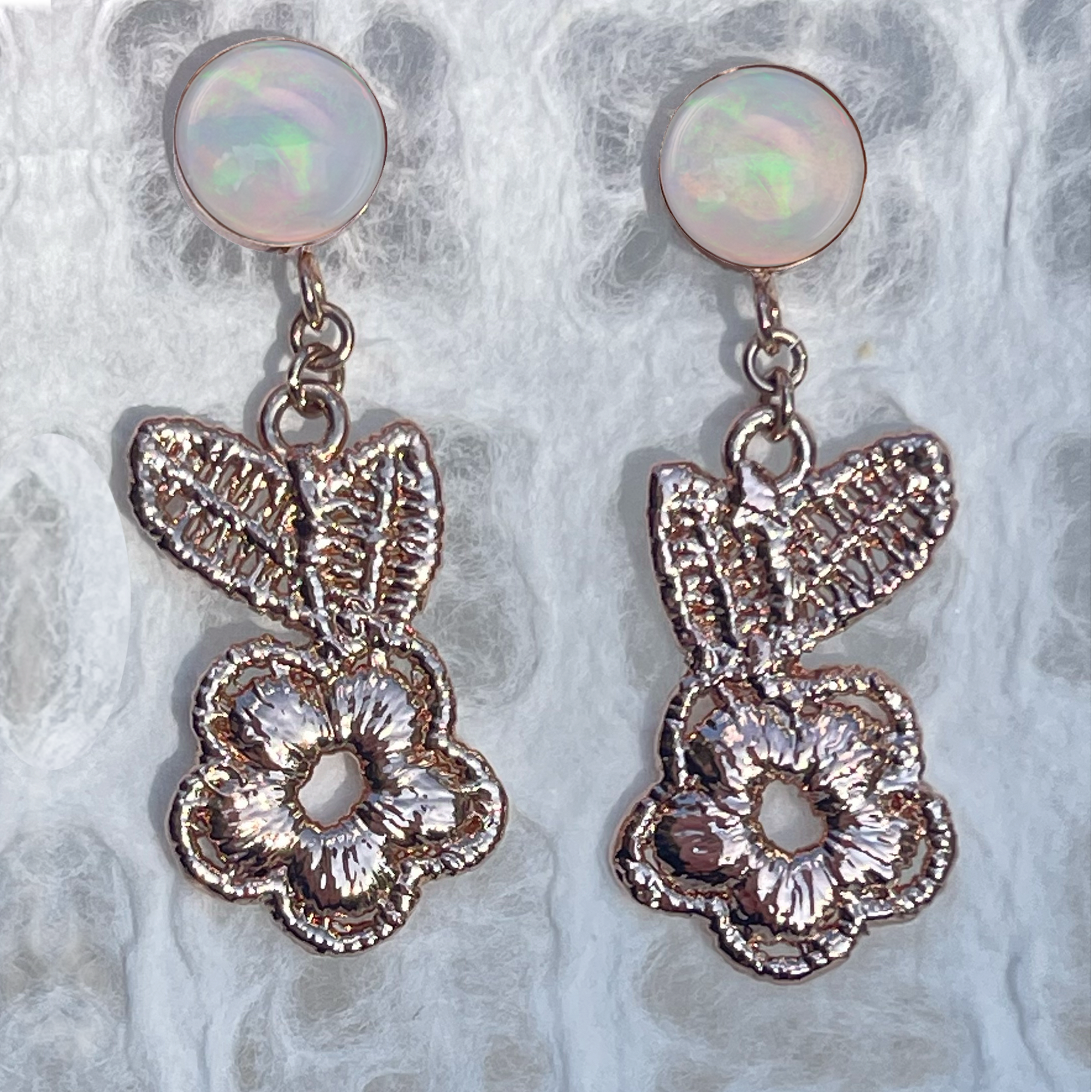 Flower lace earrings in rose gold with opals.