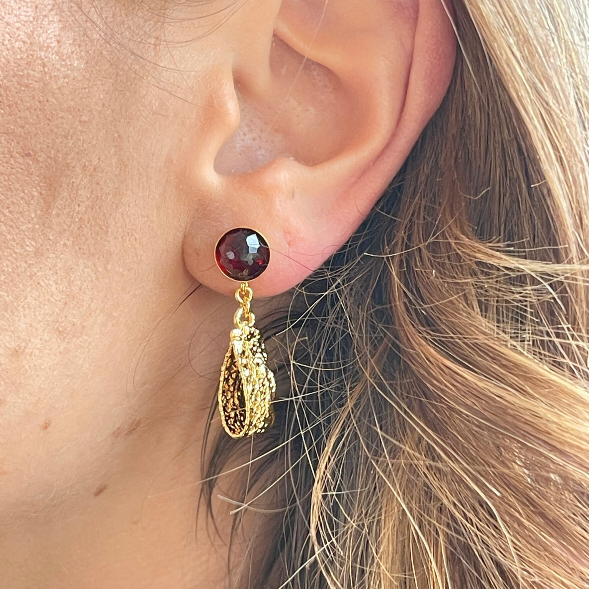 Ines lace earrings in 24k gold with faceted Garnets.