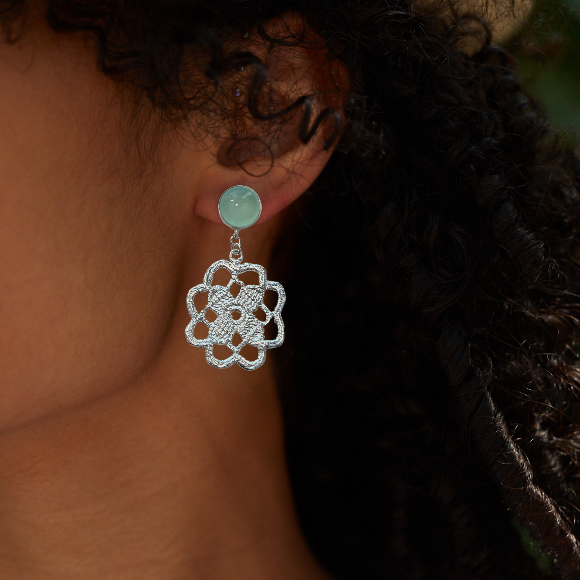 Lace flower earrings made from repurposed lace dipped in sterling silver with 10mm green Chalcedony cabochons.