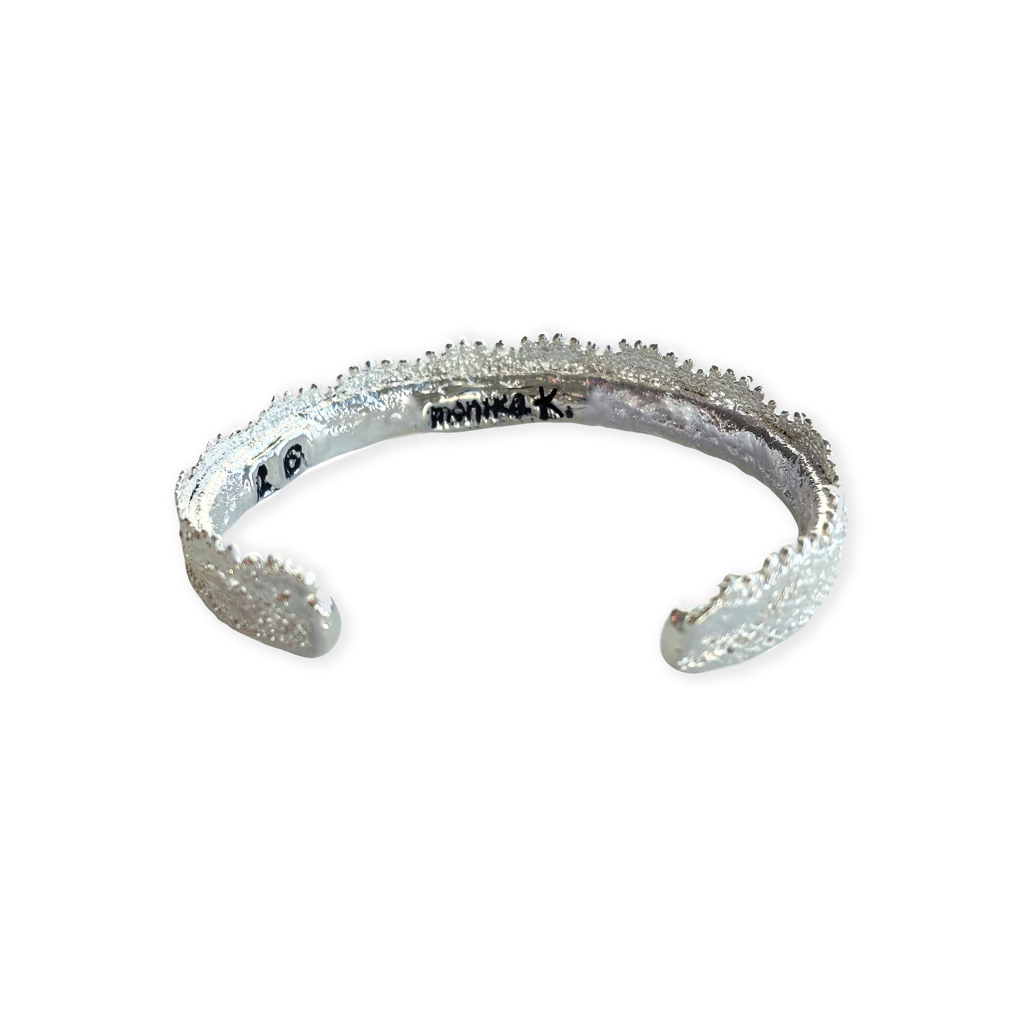 Lace bangle bracelet in sterling silver. Signed and numbered in the back.