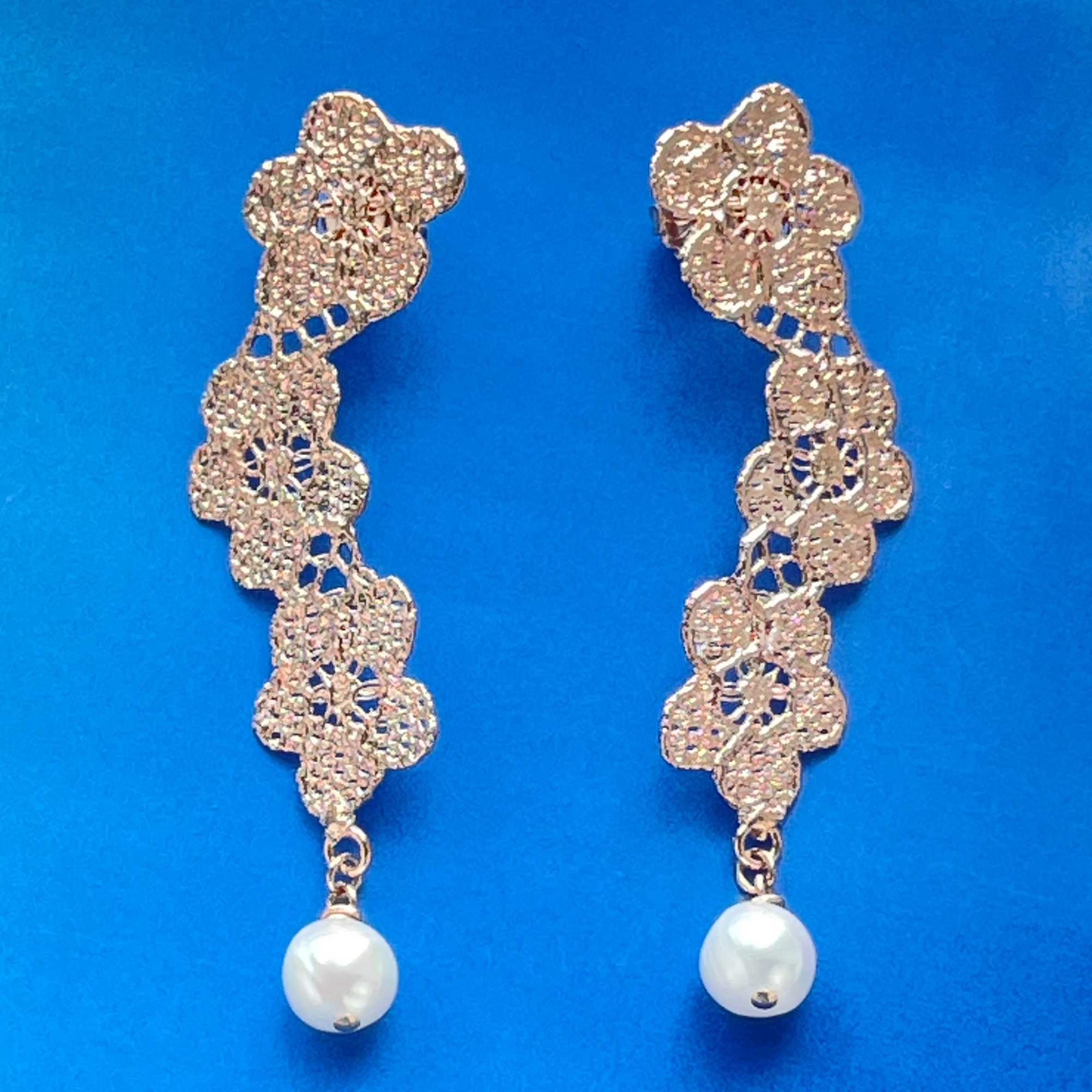Pearl earrings with lace flower garland dipped in rose gold.