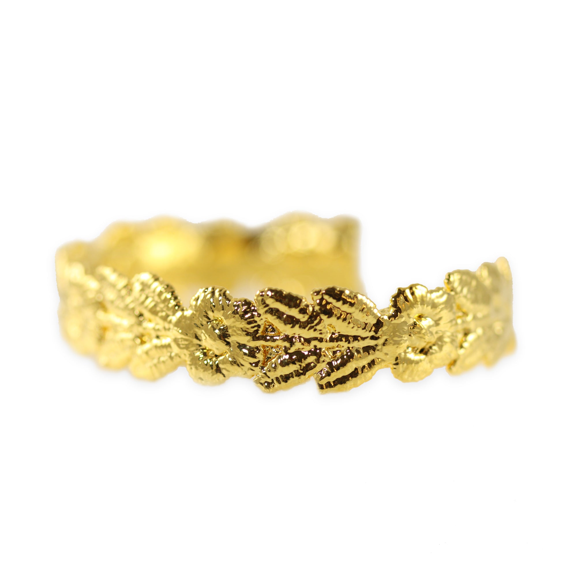 Flower garland lace bracelet dipped in 24k gold, signed and numbered in the back.