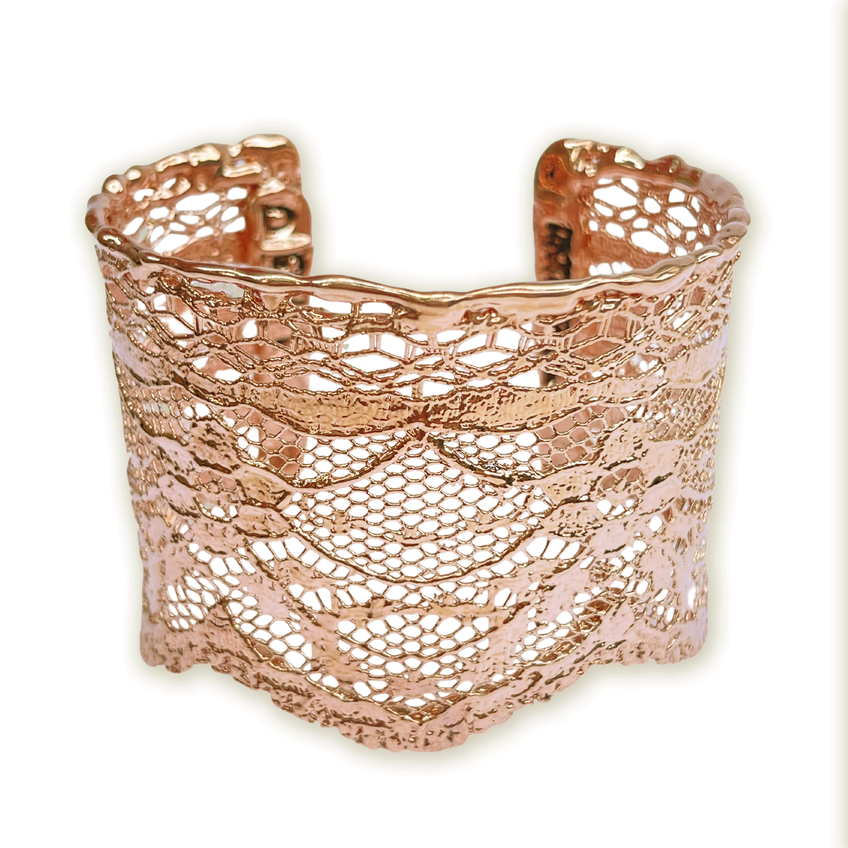 Intricate lace cuff bracelet in rose gold.