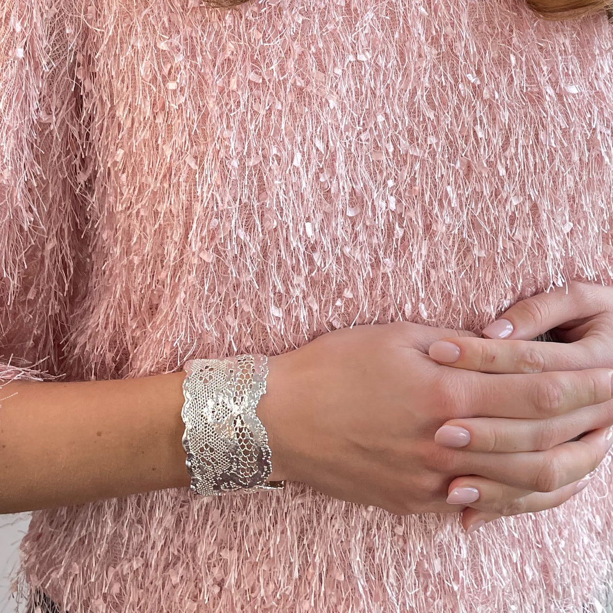 Rare double scalloped lace bracelet in sterling silver on a model.