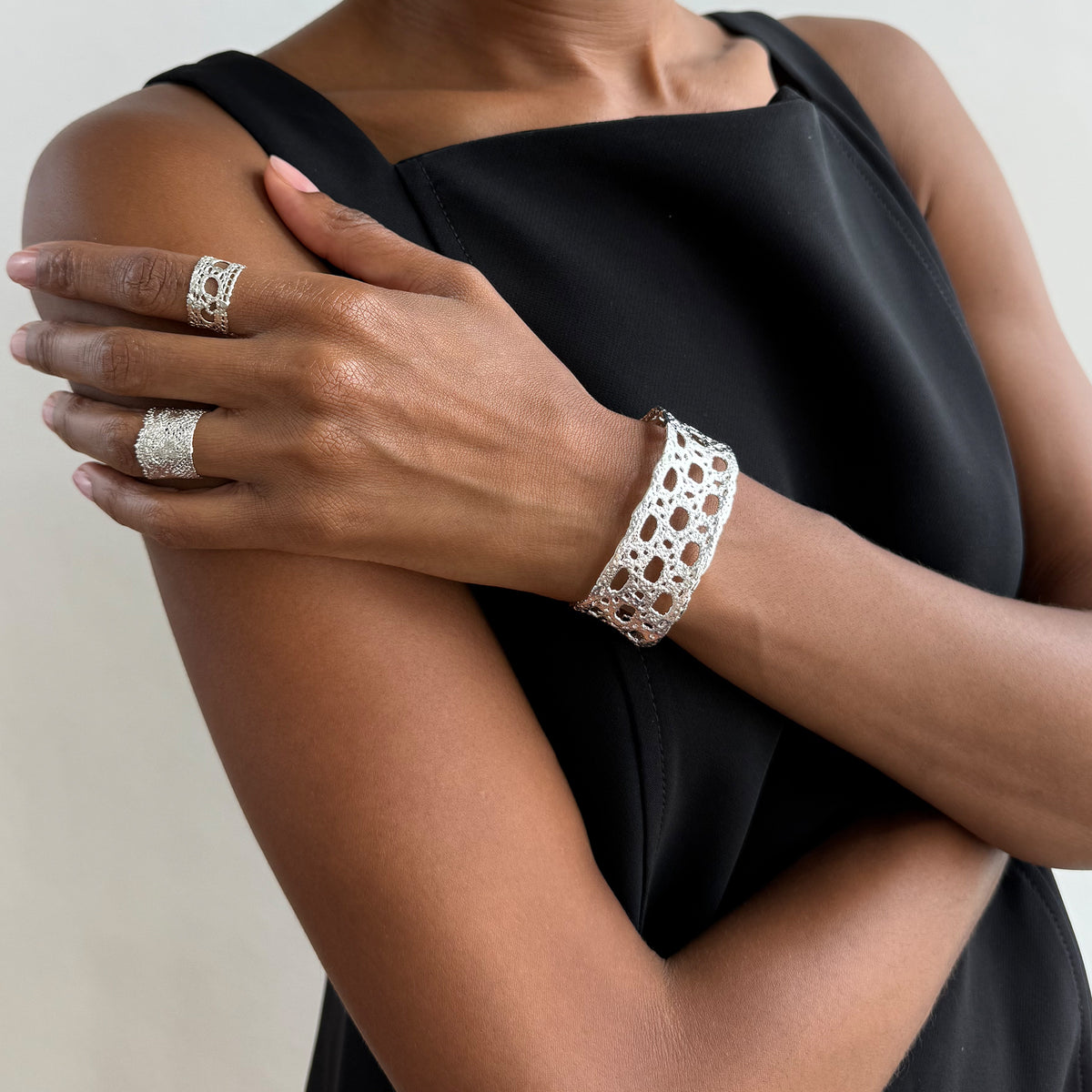 Model wearing French lace cuff bracelet dipped in sterling silver.