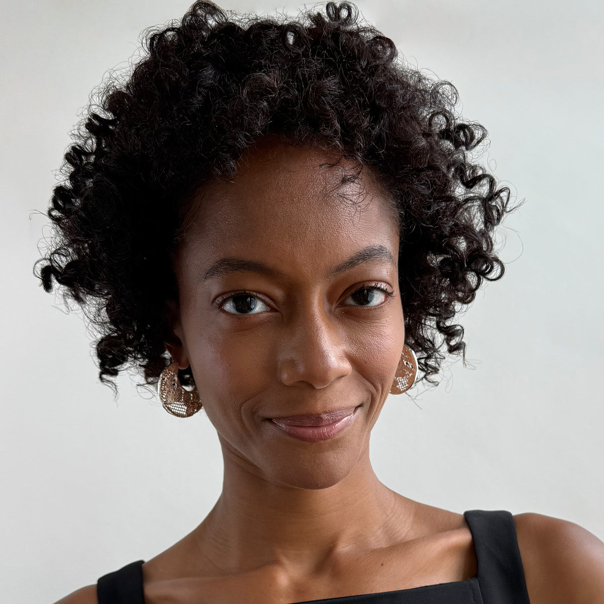 Model wearing Viviane Crescent Moon Hoop Lace Earrings in Sterling Silver.