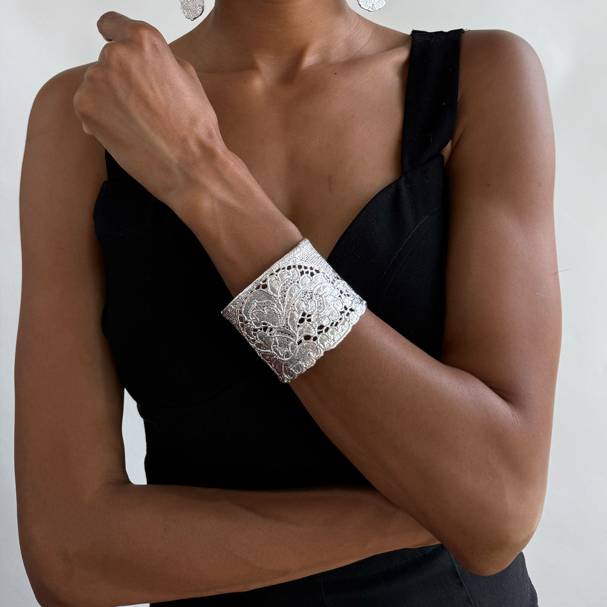 Art deco lace bracelet in sterling silver worn by model.