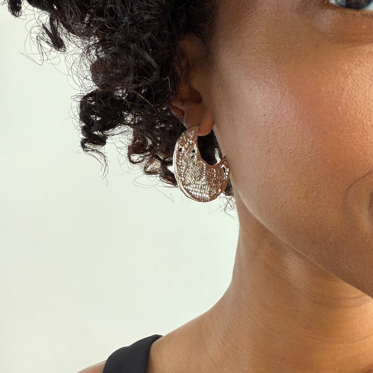 Model wearing Viviane Crescent Moon Hoop Lace Earrings in Sterling Silver.
