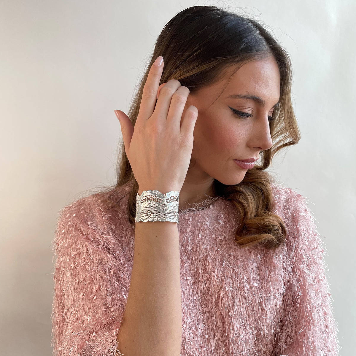 Rare double scalloped lace bracelet in sterling silver on a model.