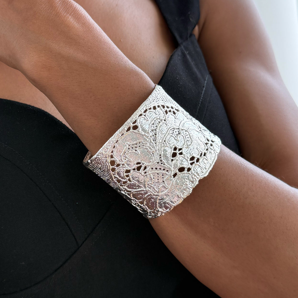Art deco lace bracelet in sterling silver worn by model.