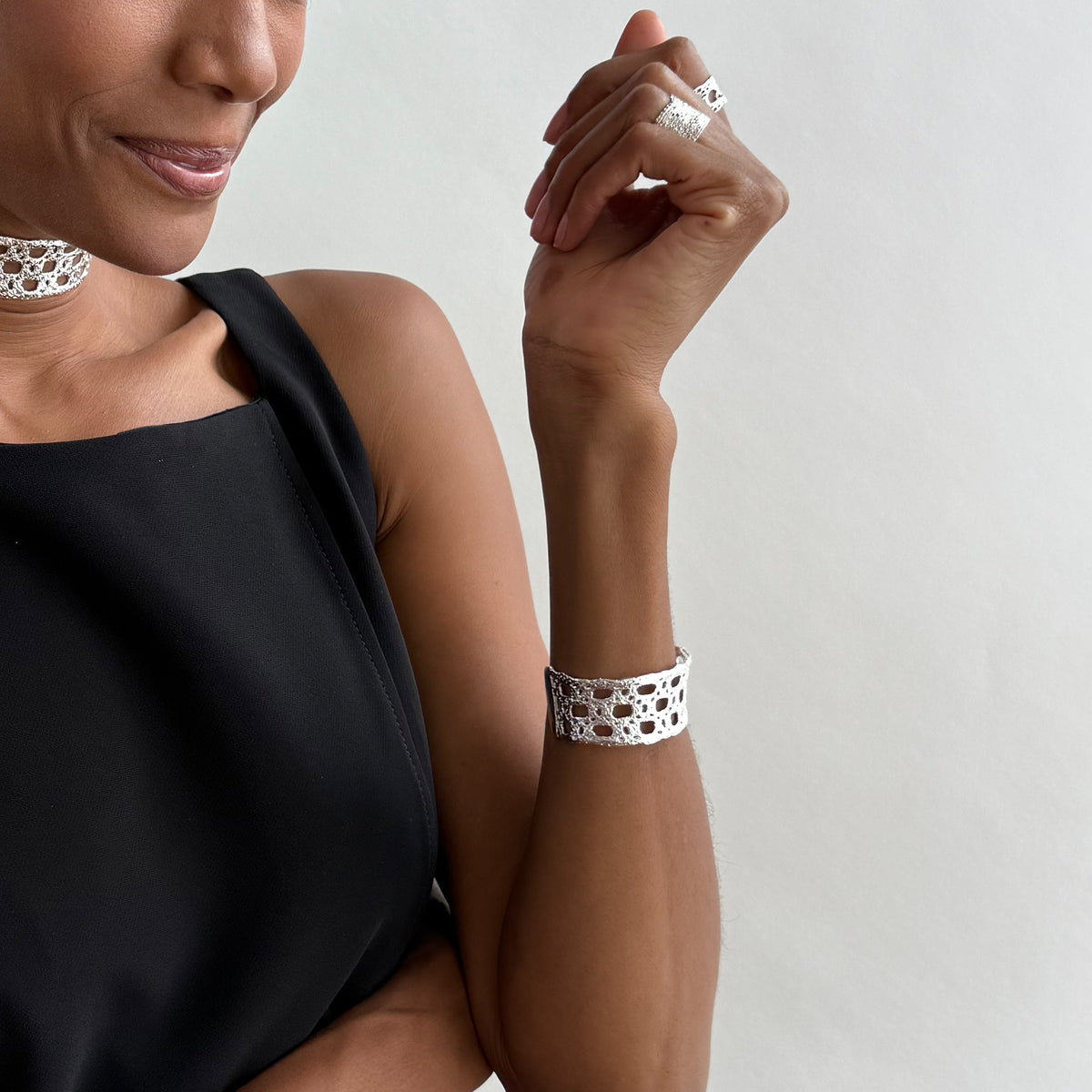 Model wearing French lace cuff bracelet dipped in sterling silver.