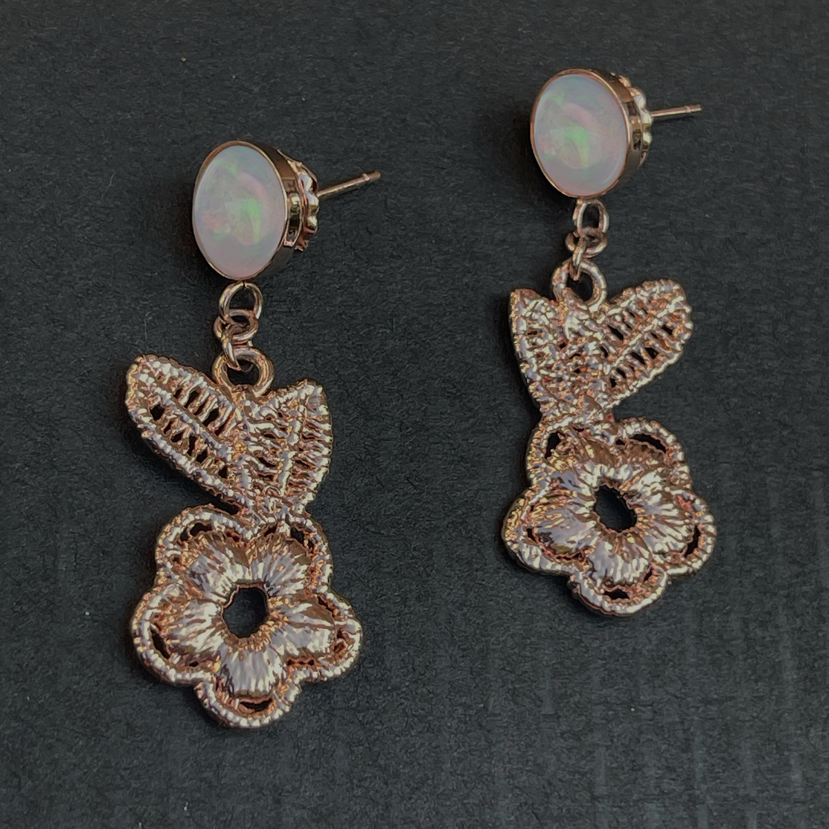 Flower lace earrings in rose gold with opals.