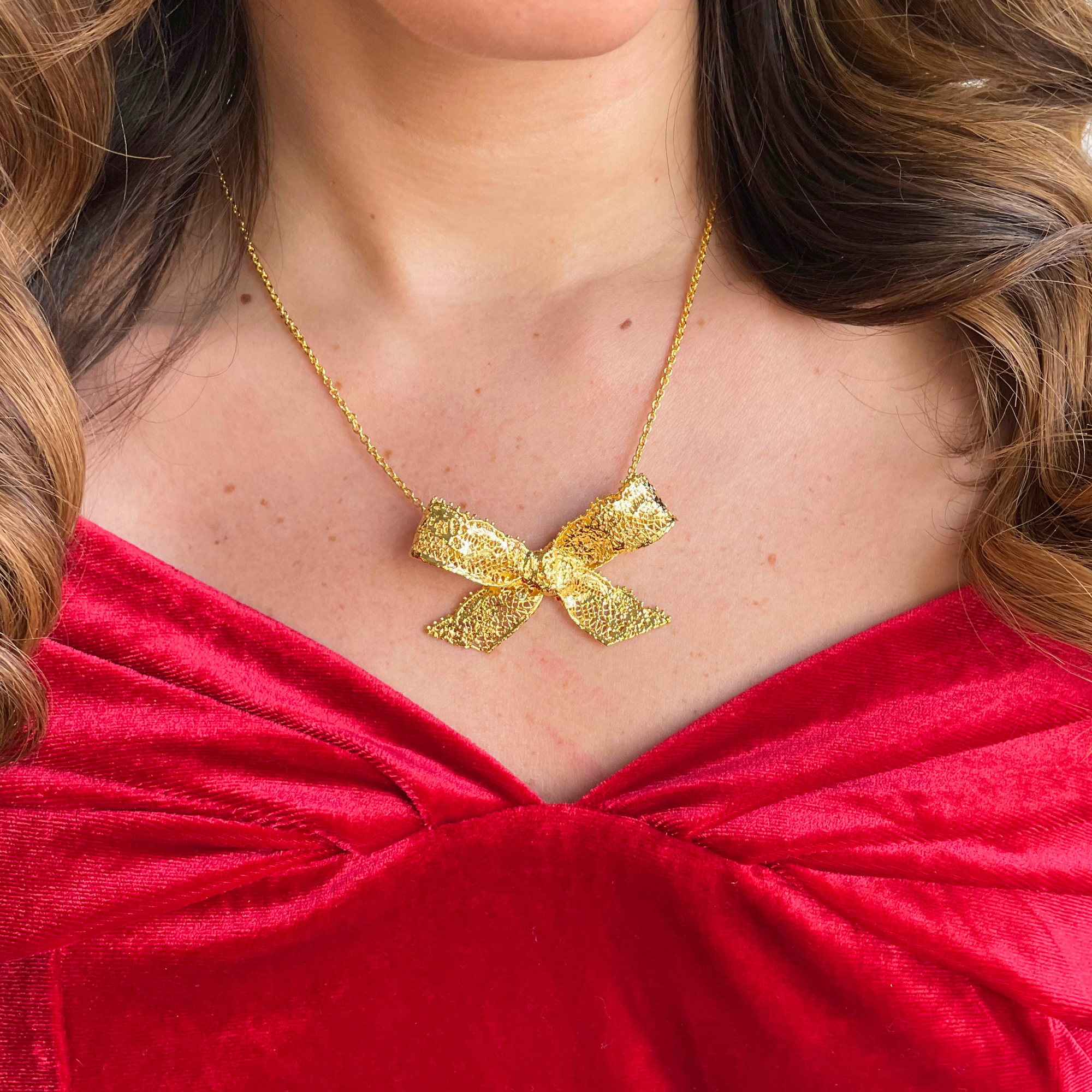 Micheline Lace Bow Necklace in 24k gold.