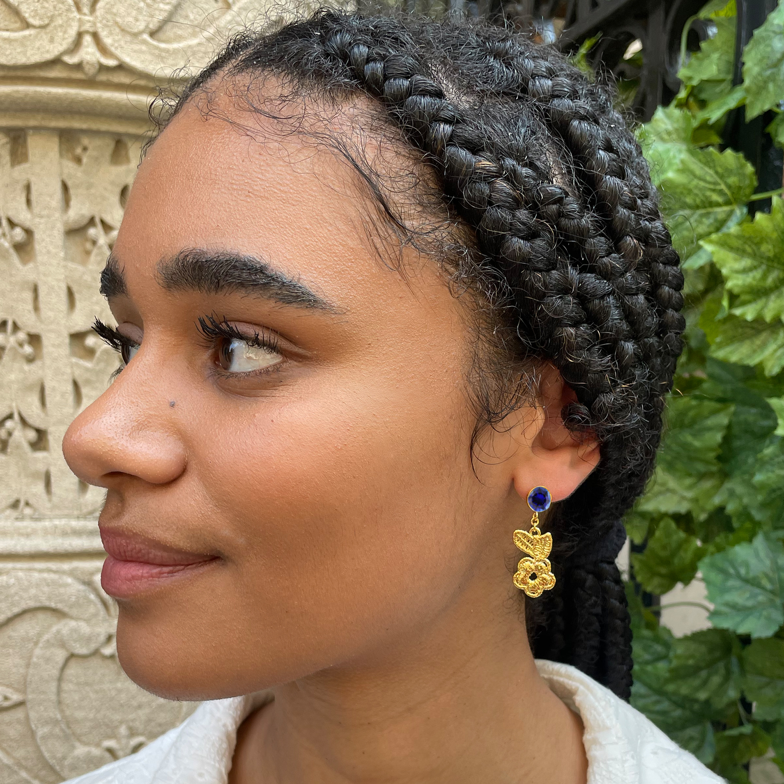 Flower lace earrings in 24k gold with blue sapphires.