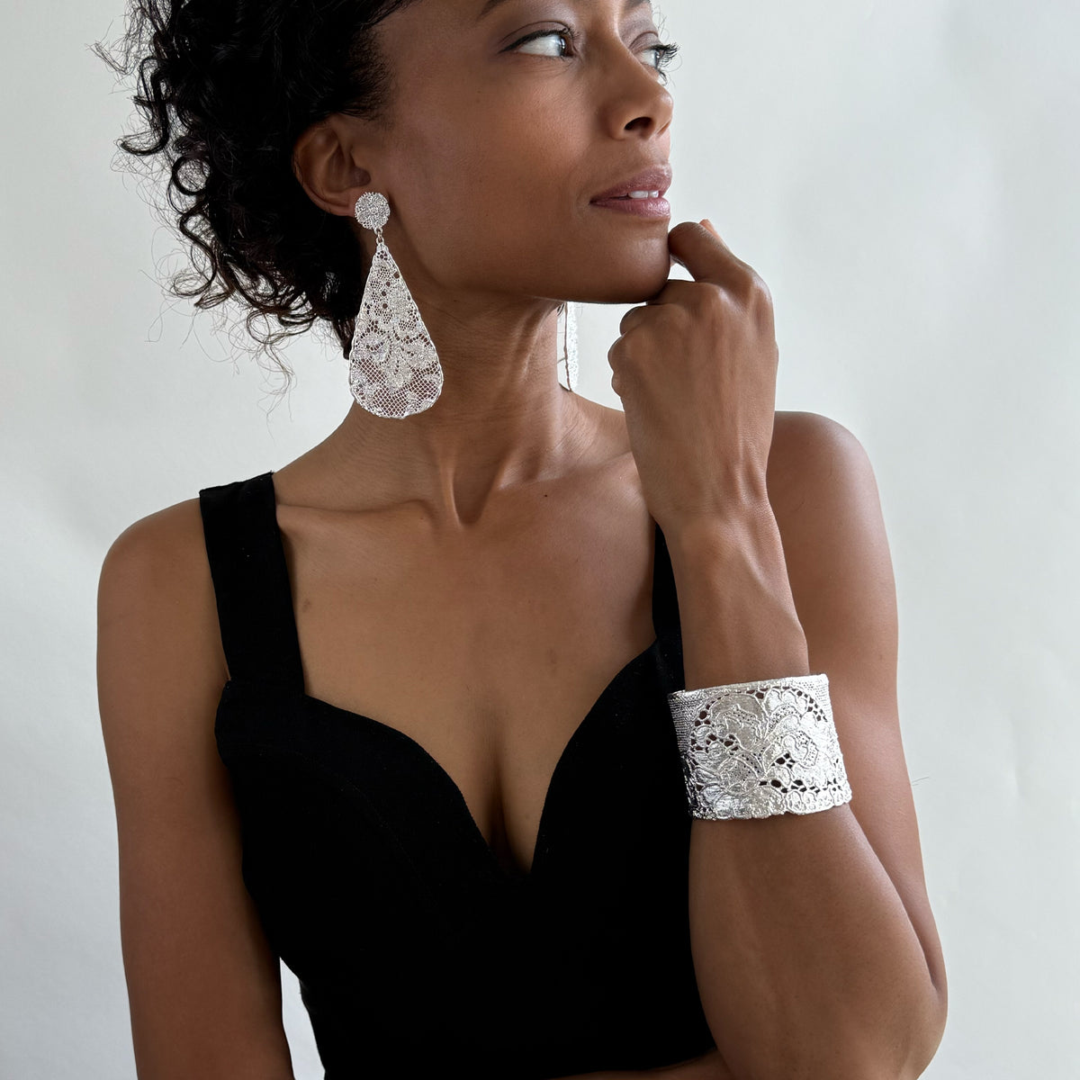 Art deco lace bracelet in sterling silver worn by model.