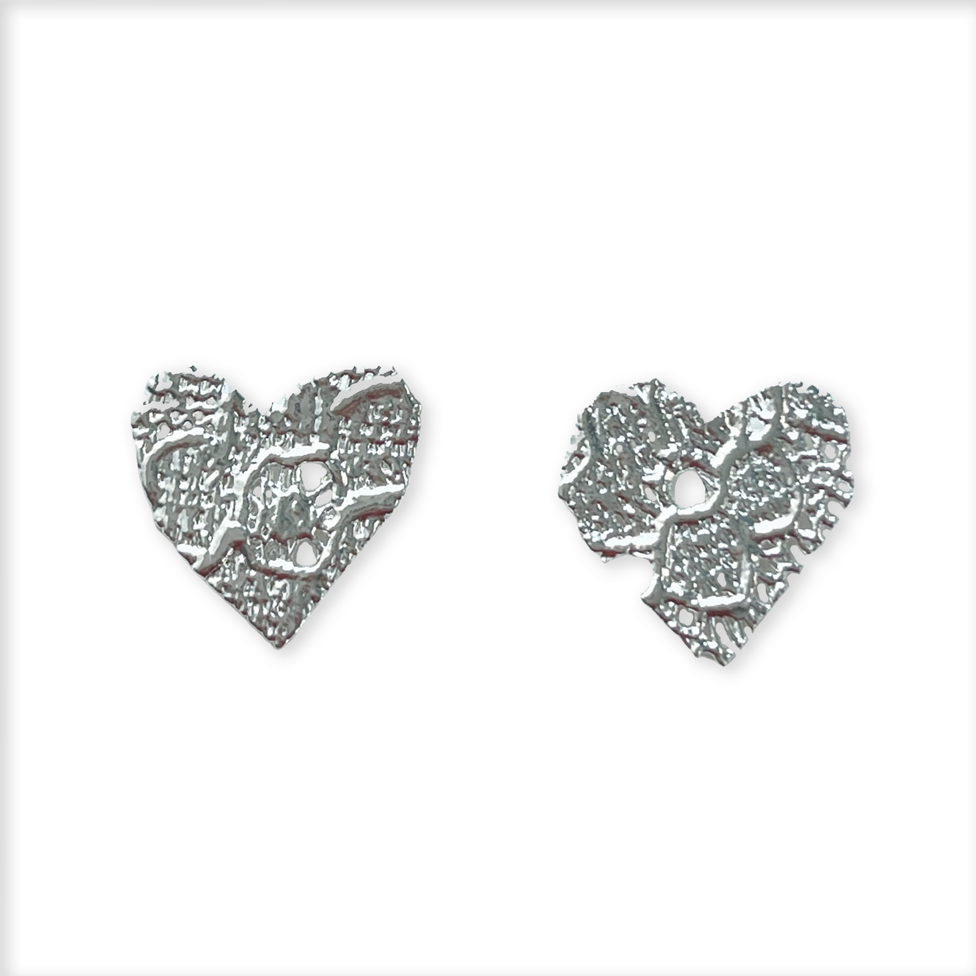 Lace heart stud earrings in rose gold.