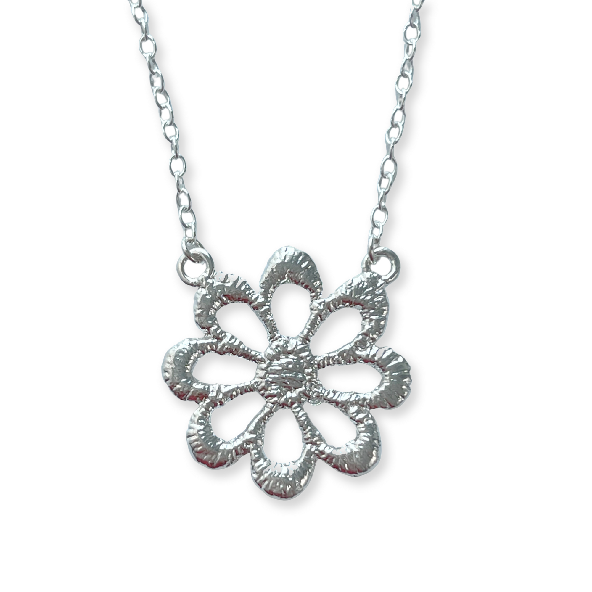 Lace flower necklace in sterling silver.