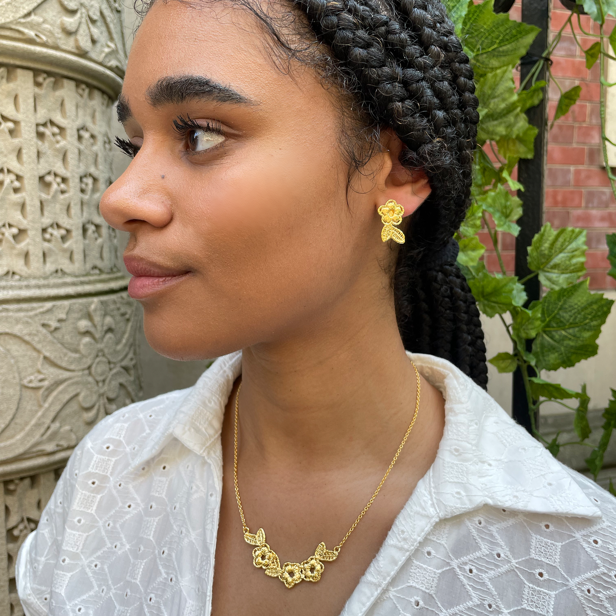 Flower lace stud earrings and lace necklace in 24k gold.