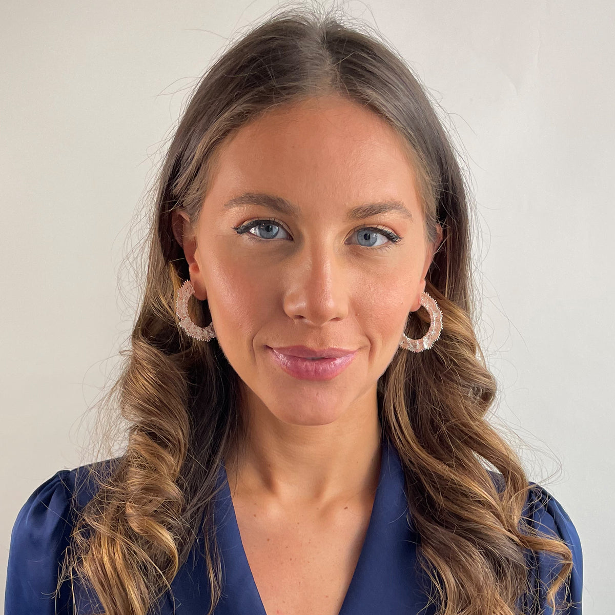 Jeanne lace hoop earrings small in sterling silver on a model.