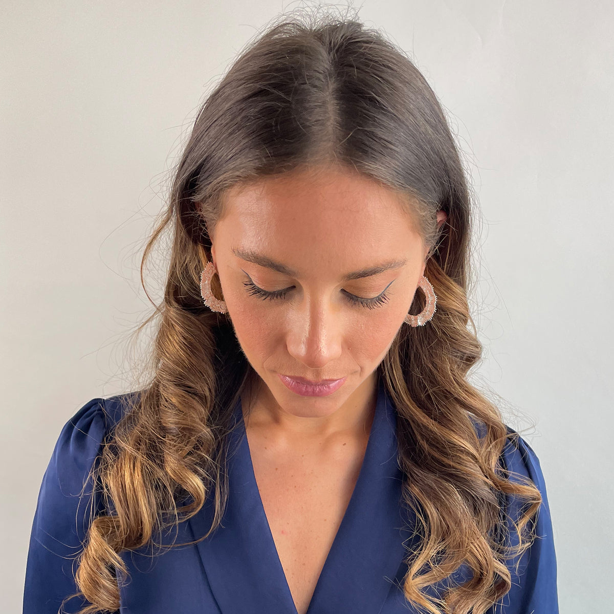 Jeanne lace hoop earrings small in sterling silver on a model.