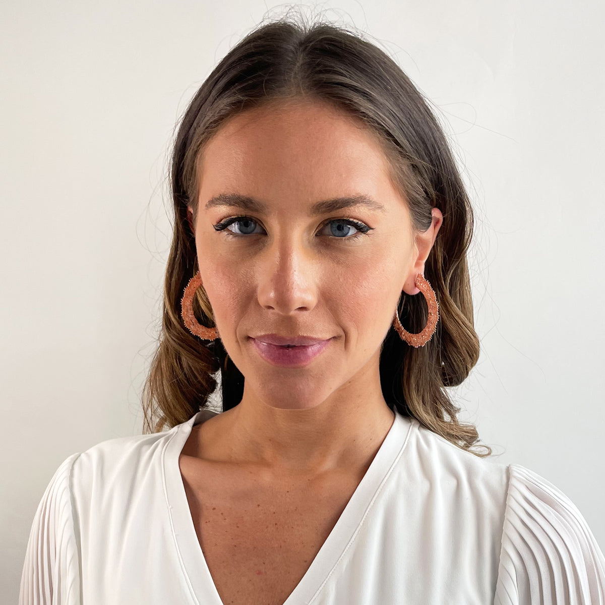 Juliette Lace Hoop Earrings Medium sized in rose gold on model.