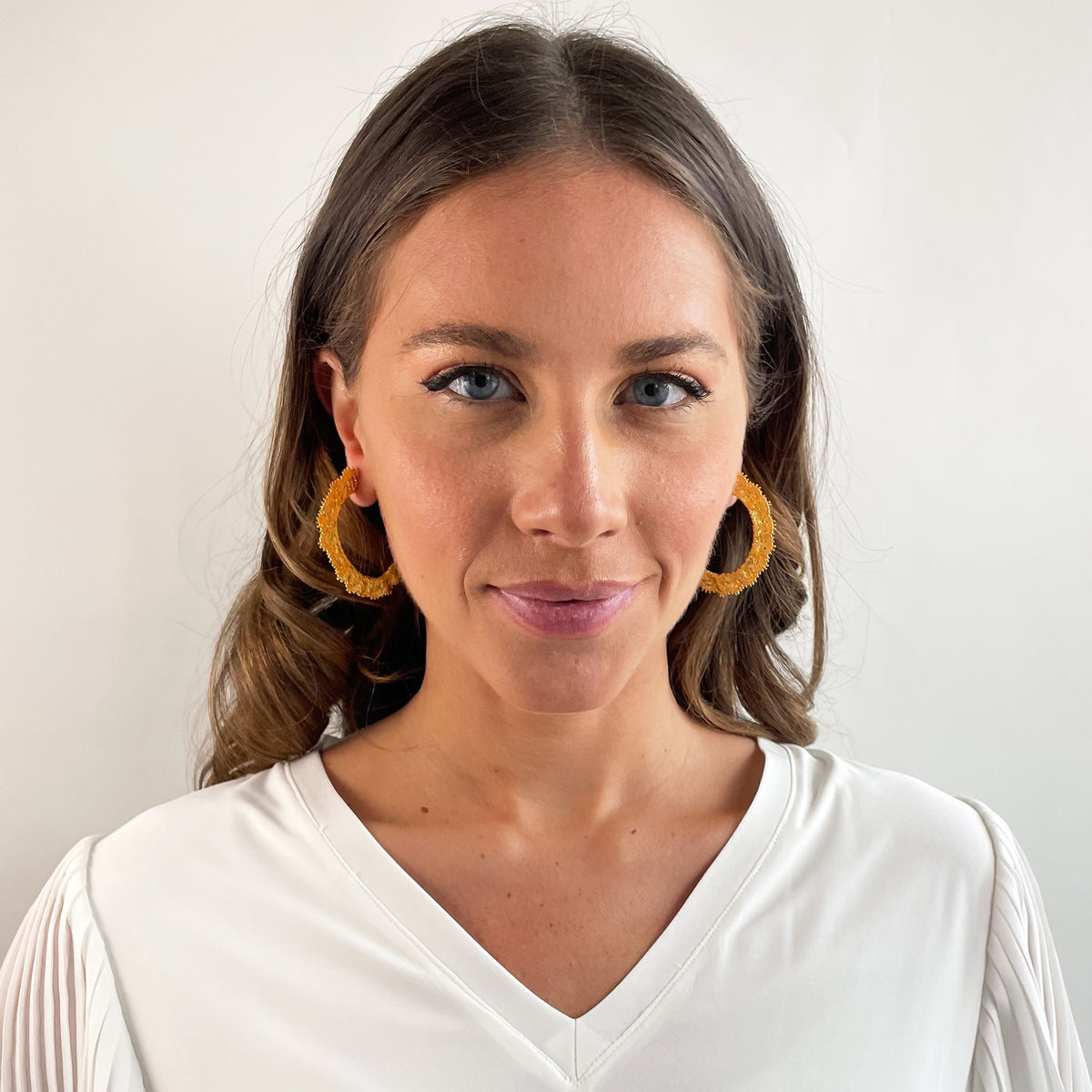 Juliette Lace Hoop Earrings Medium sized in 24k gold on model.