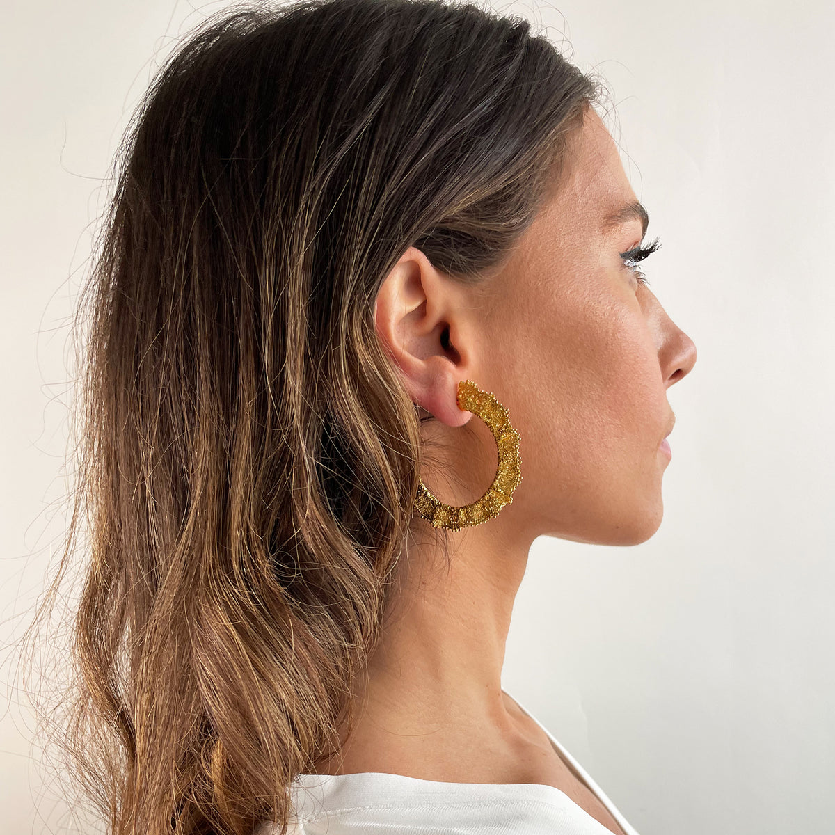 Juliette Lace Hoop Earrings Medium sized in 24k gold on model.