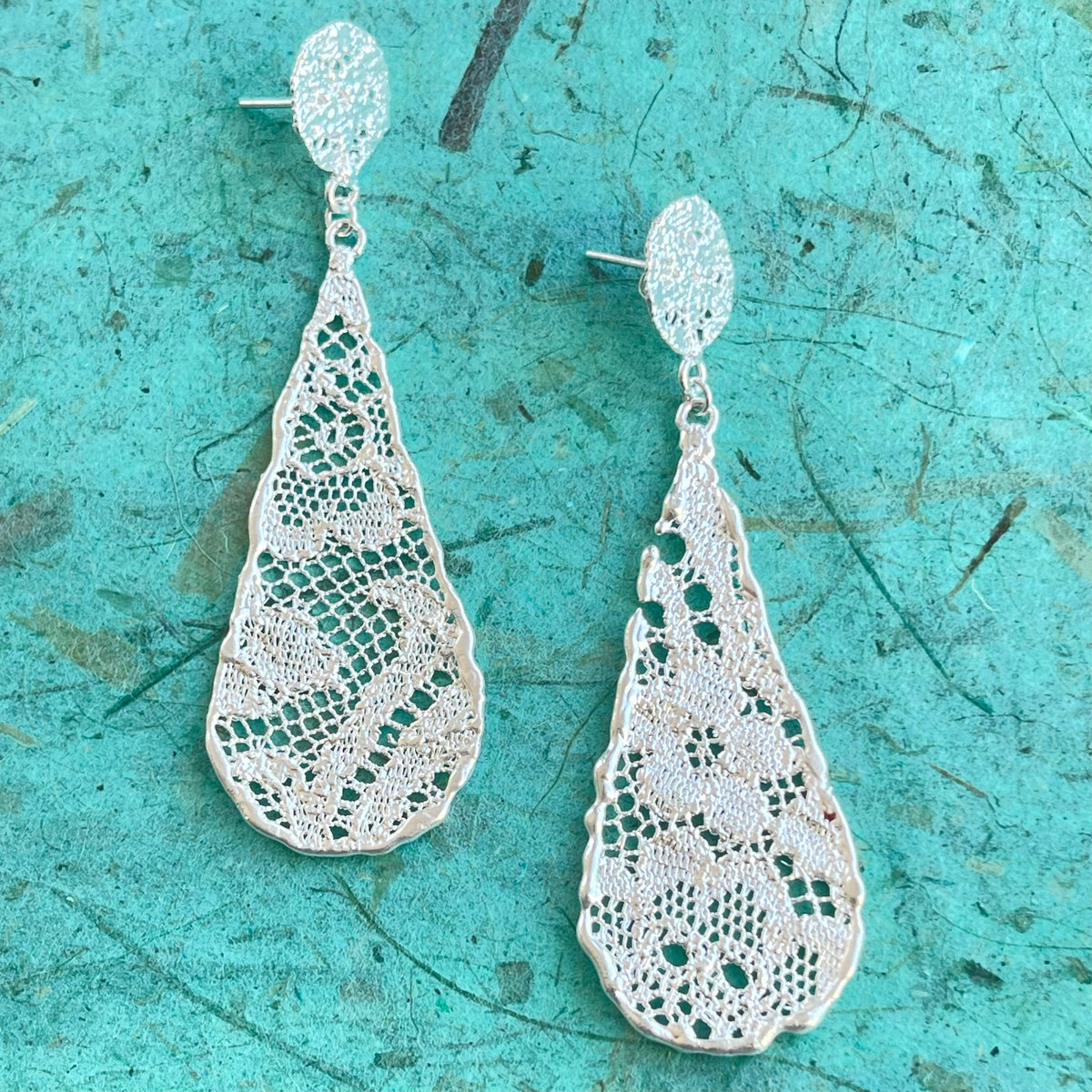 Teardrop lace earrings dipped in sterling silver.
