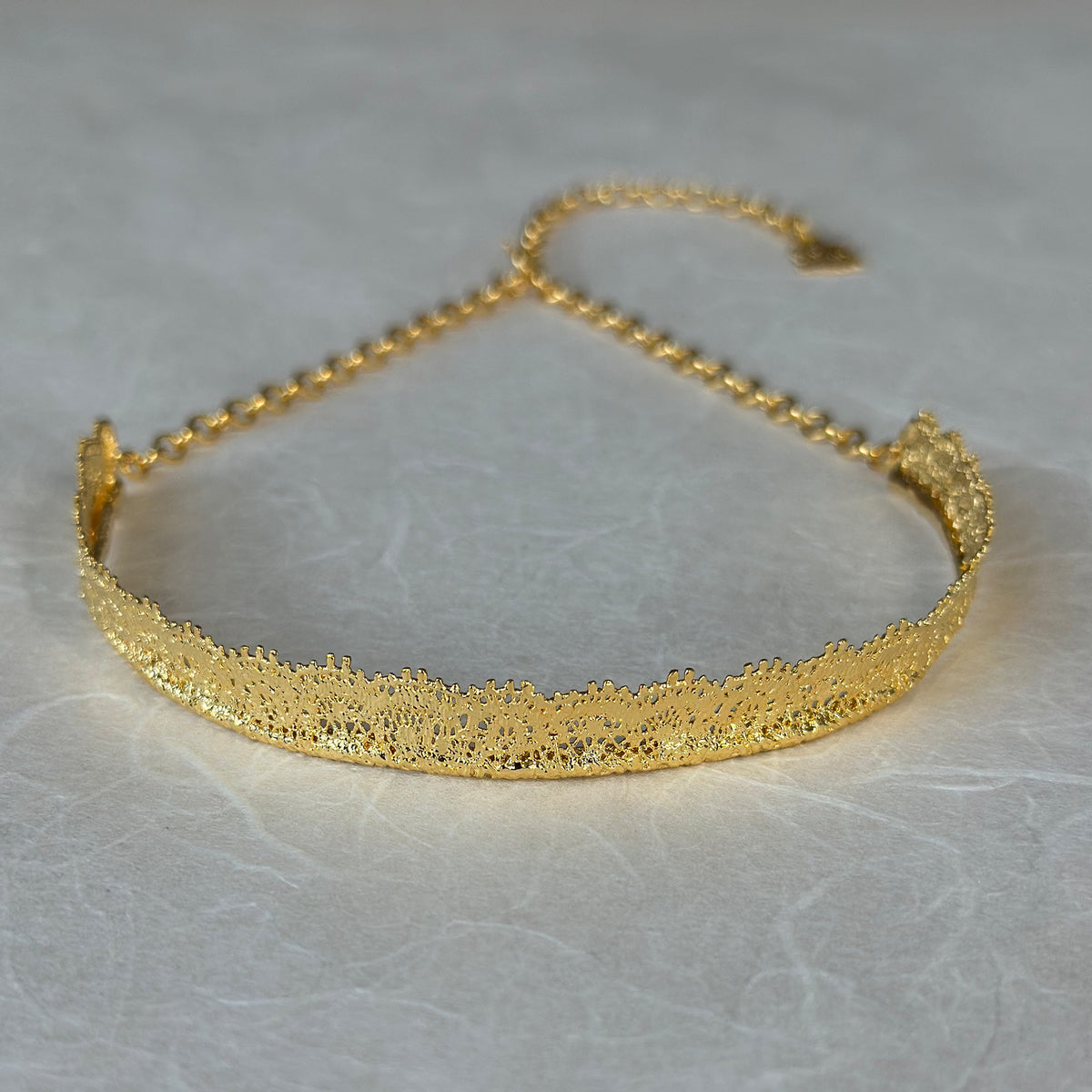 Leontine lace choker necklace in 24k gold.