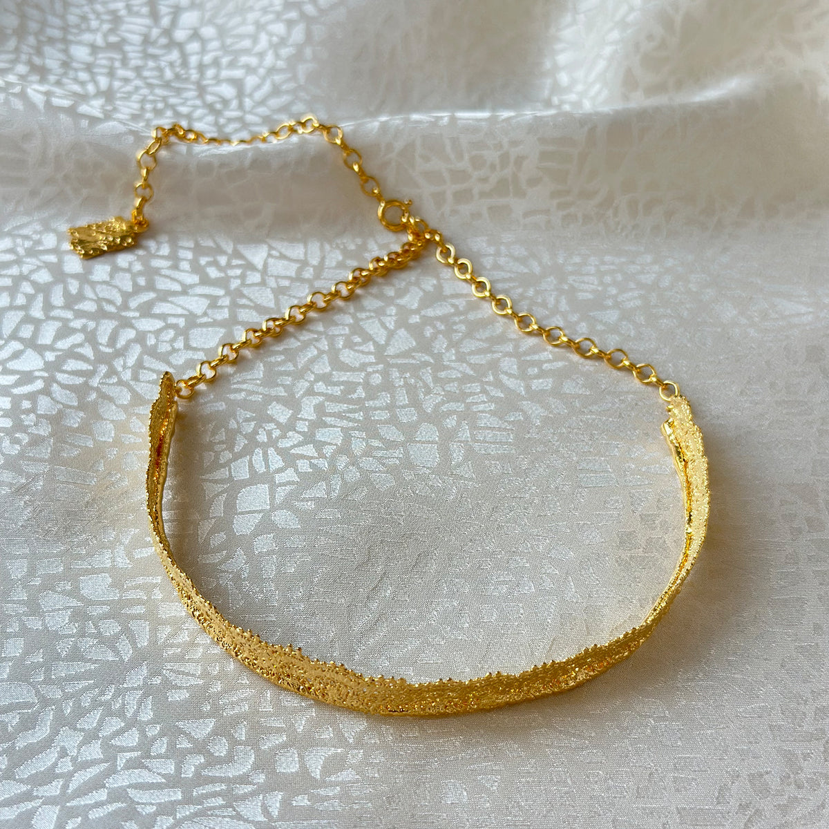 Leontine lace choker necklace in 24k gold.