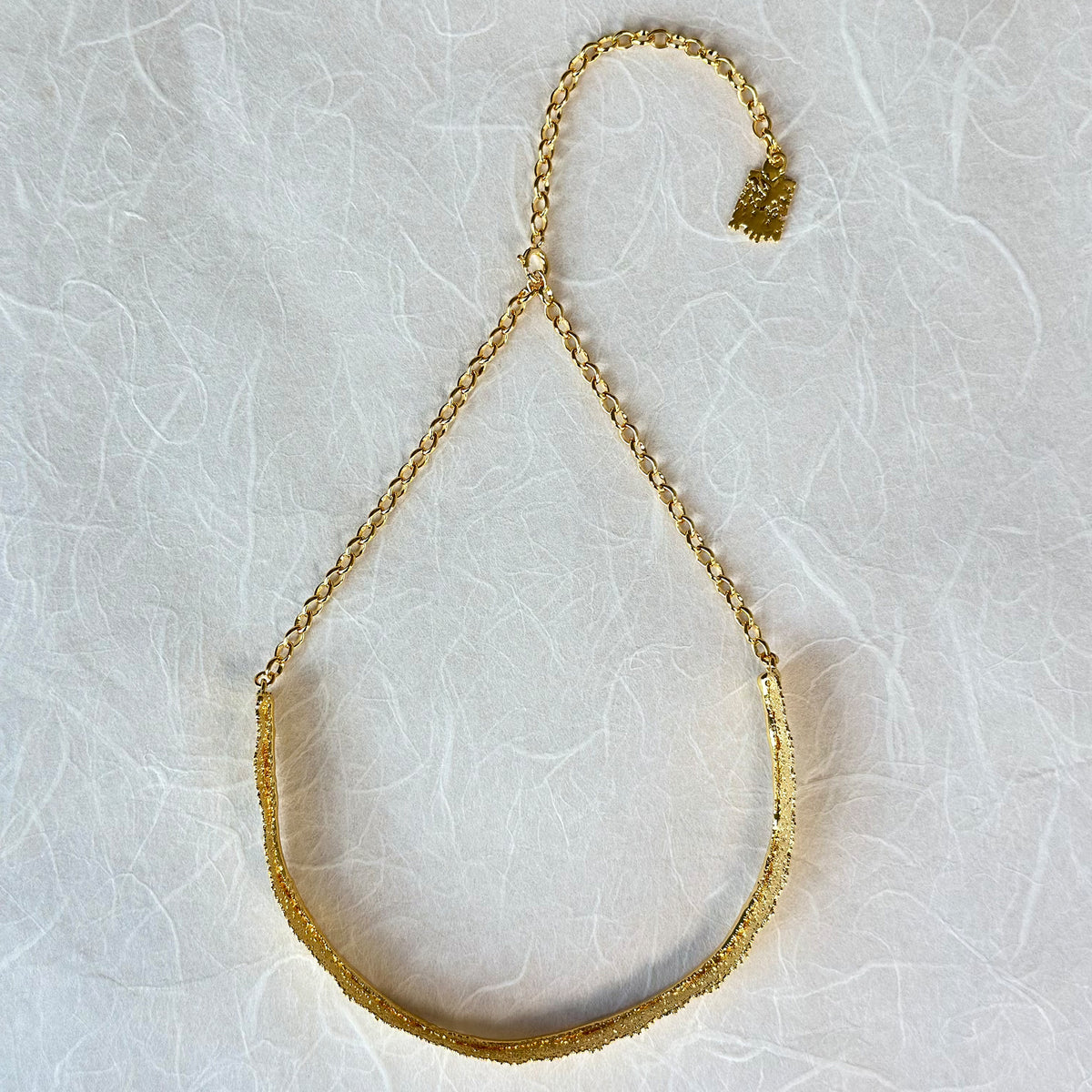 Leontine lace choker necklace in 24k gold.