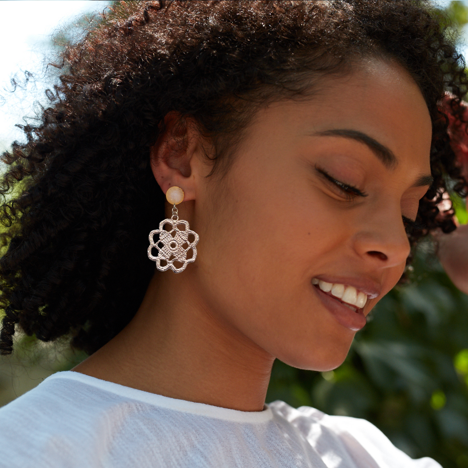 Lace flower earrings made from repurposed lace dipped in rose gold with 10mm moonstone cabochons.