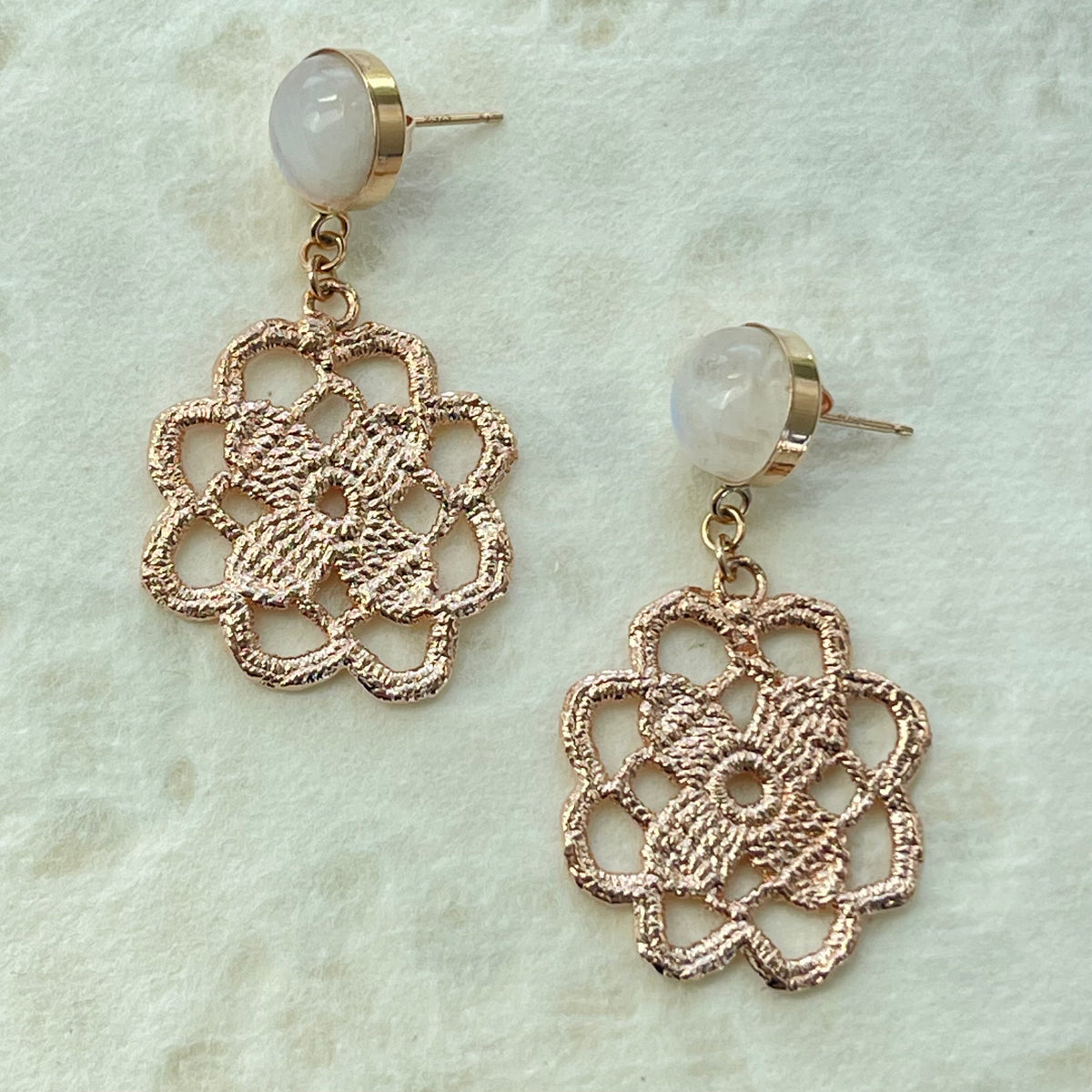 Lace flower earrings made from repurposed lace dipped in rose gold with 10mm moonstone cabochons.