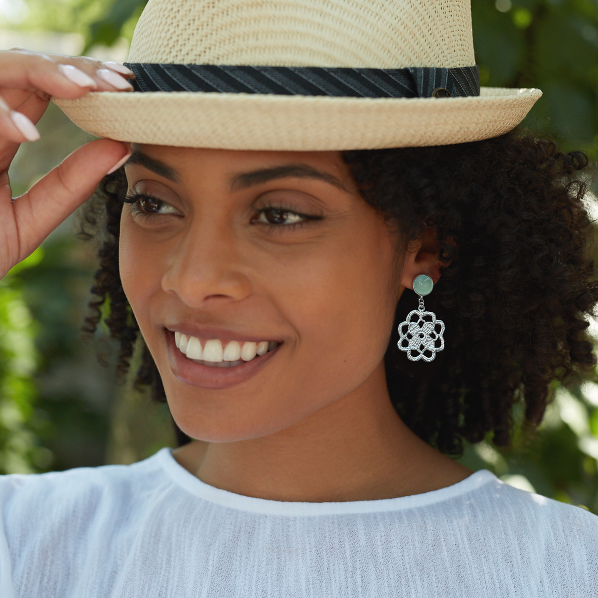 Lace flower earrings made from repurposed lace dipped in sterling silver with 10mm green Chalcedony cabochons.
