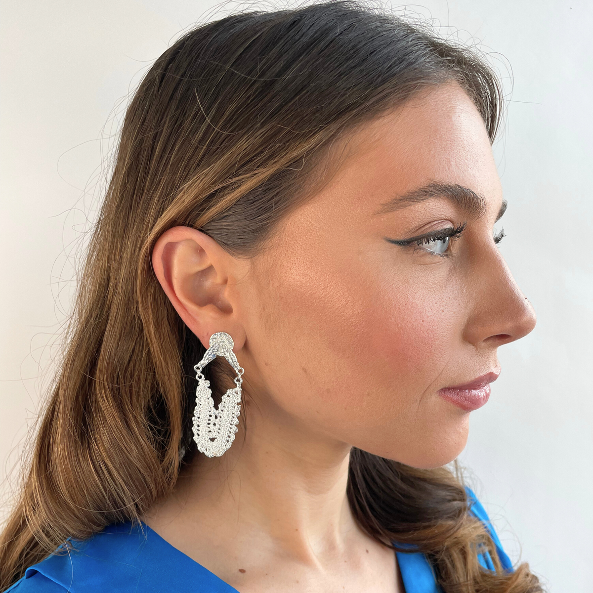 Maj-Britt lace earrings from Swedish 1940s lace in sterling silver worn by a model.
