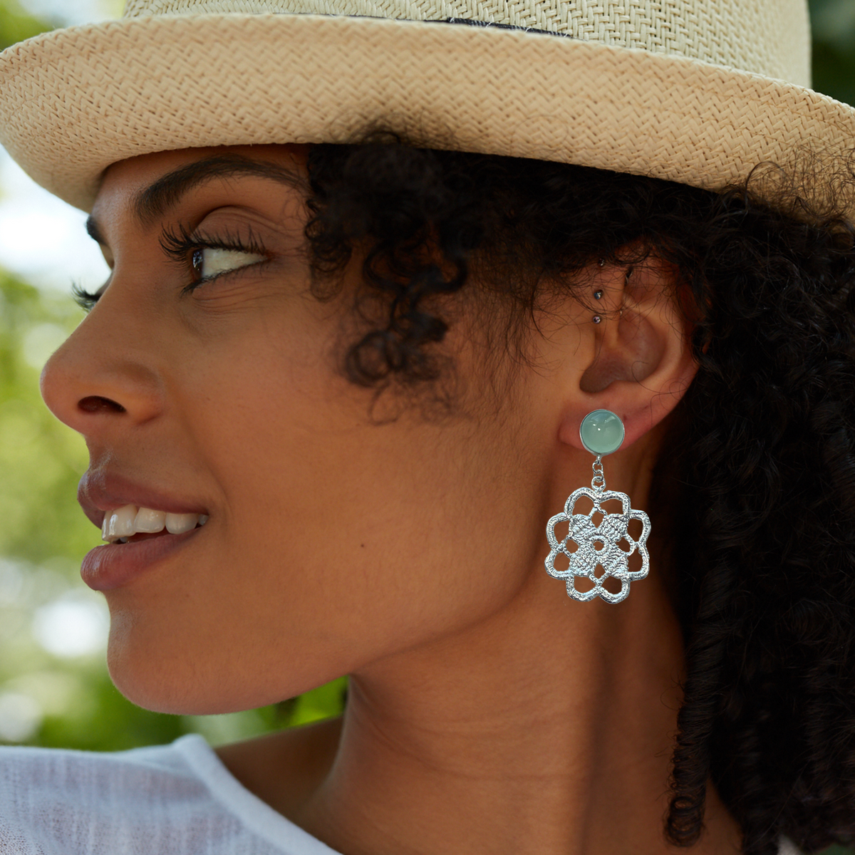 Lace flower earrings made from repurposed lace dipped in sterling silver with 10mm green Chalcedony cabochons.