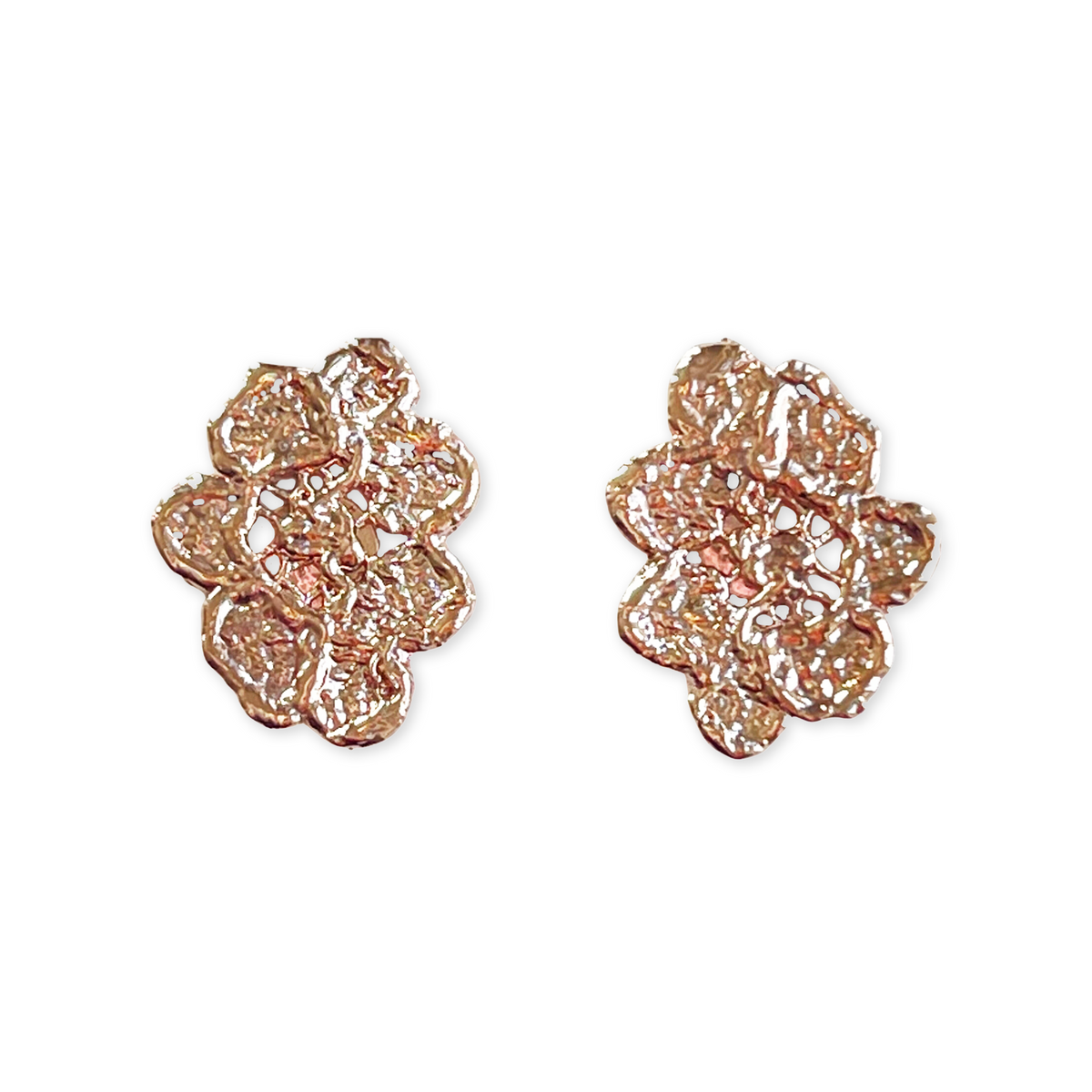 Small, exquisite stud earring in the shape of a lace flower dipped in rose gold.