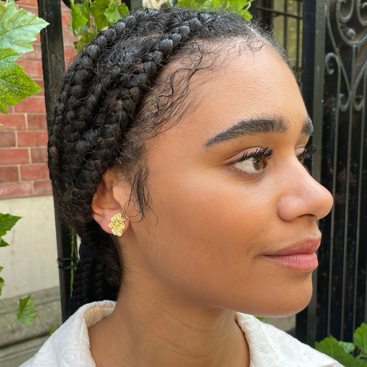 Small, exquisite stud earring in the shape of a lace flower dipped in 24k gold.