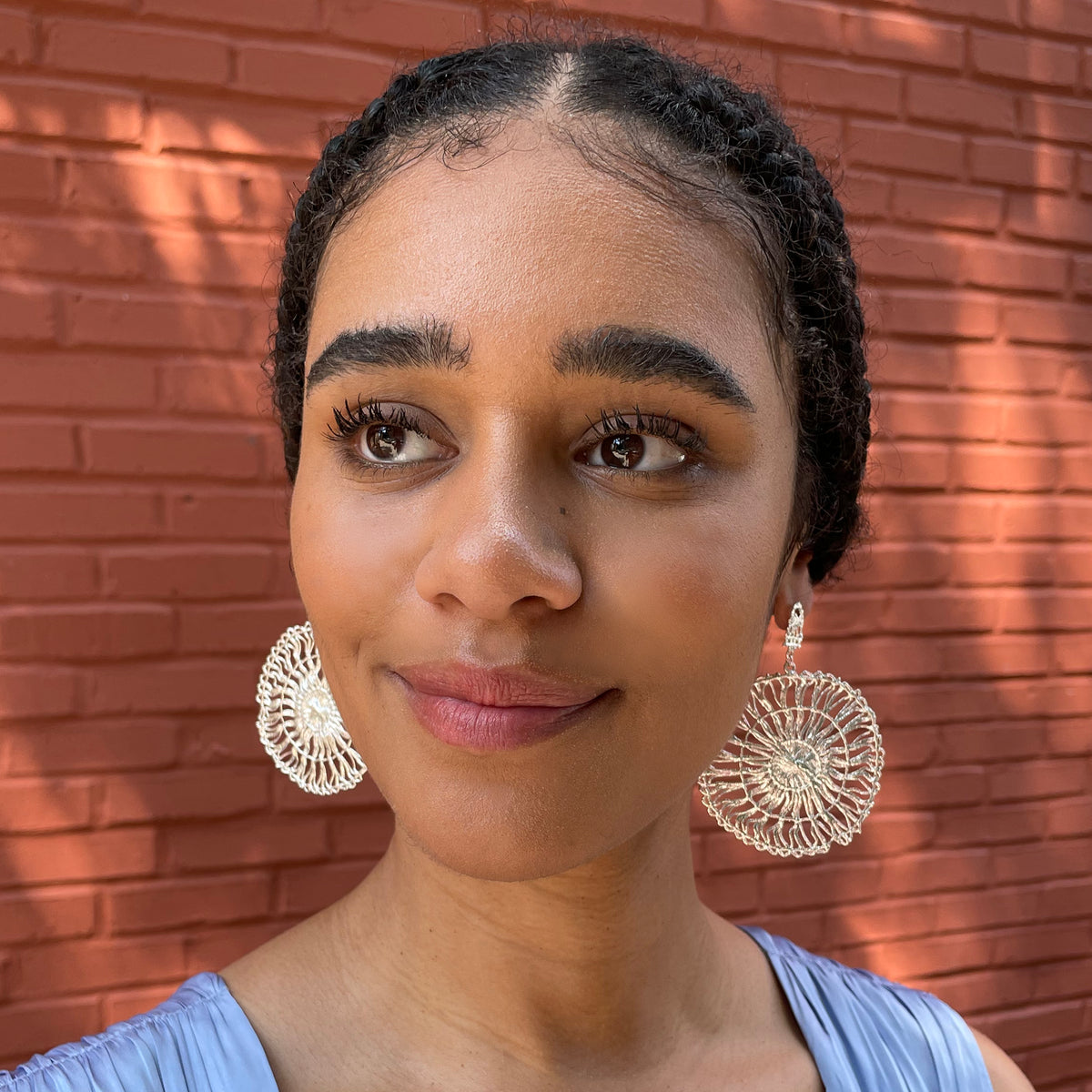 Circular lace pendant earrings made from Tenerife lace. Solidified in sterling silver.