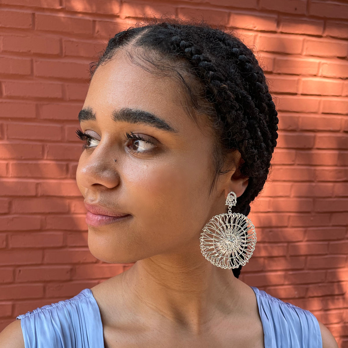 Circular lace pendant earrings made from Tenerife lace. Solidified in sterling silver.