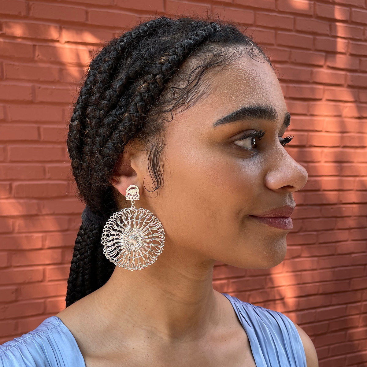 Circular lace pendant earrings made from Tenerife lace. Solidified in sterling silver.