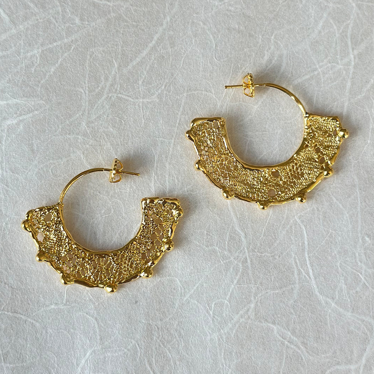 Violette 24k gold hoop earrings with intricate designs