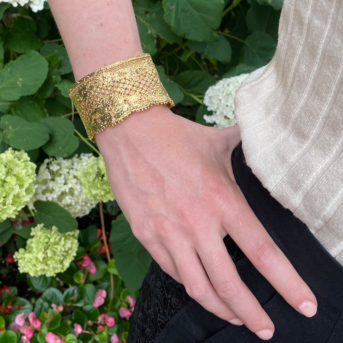 Gorgeous cuff bracelet made from French lace dipped in 24k gold, signed and numbered inside, on model.