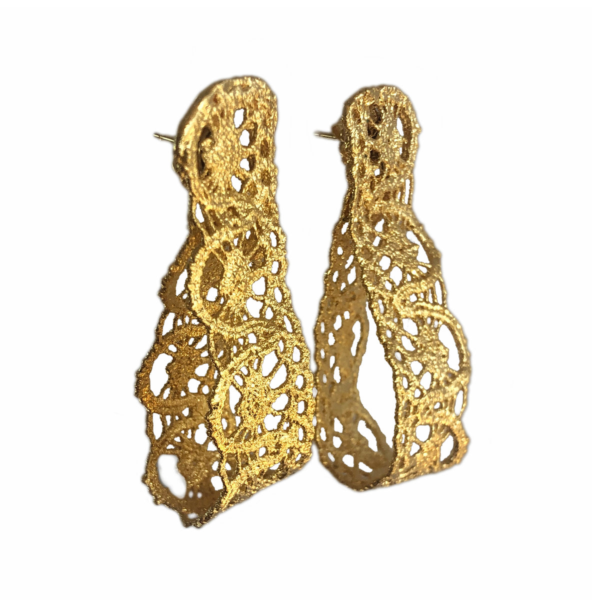 Favorite earrings made from French 1920s lace forming a loop and solidified in 24k gold.
