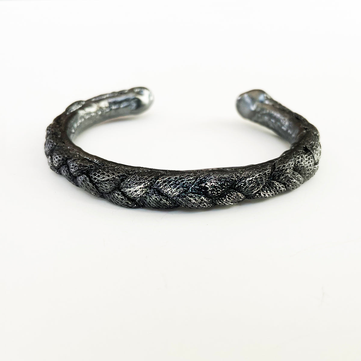Braided open men&#39;s bangle bracelet in dark oxidized sterling silver.