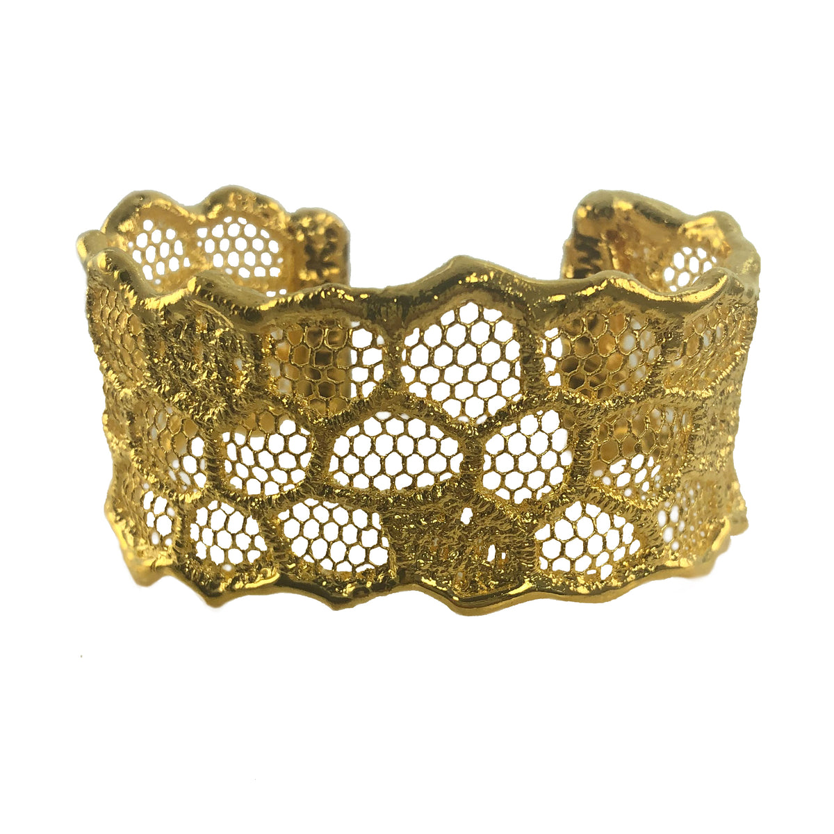 Cuff bracelet made from an intricate honeycomb lace dipped in 24k gold.