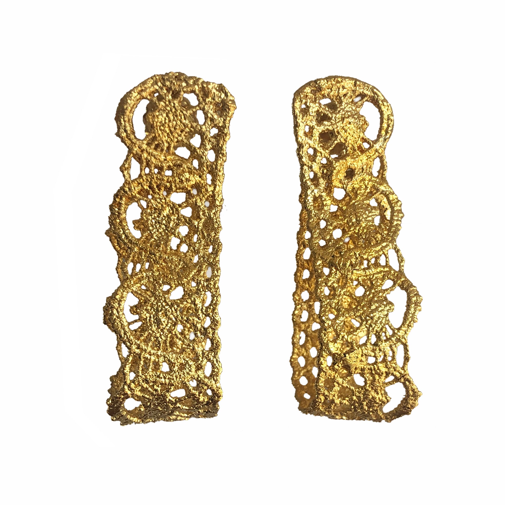 Favorite earrings made from French 1920s lace forming a loop and solidified in 24k gold.