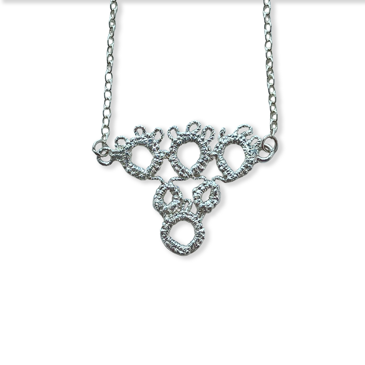 Irish tatted lace pendant necklace in sterling silver.