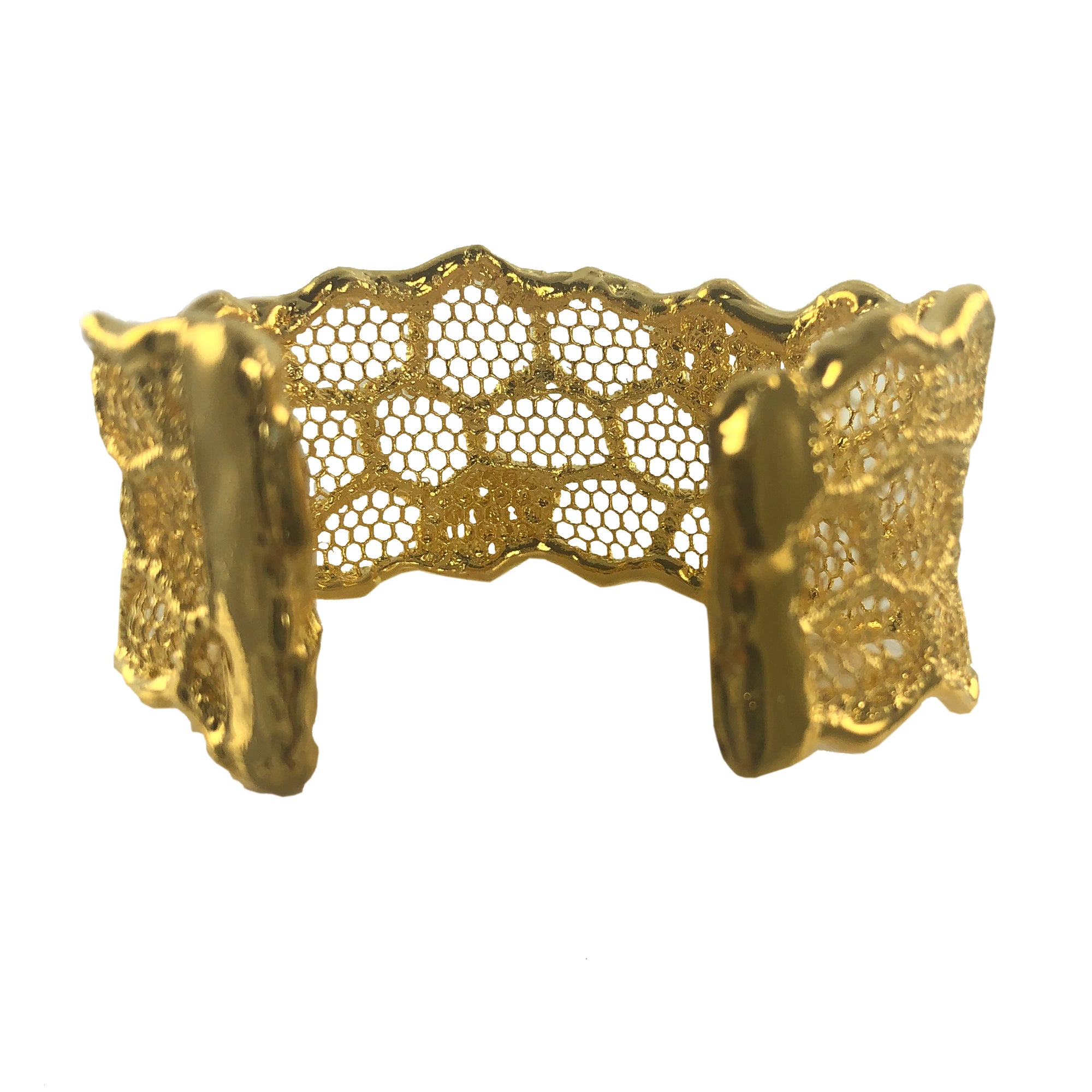 Cuff bracelet made from an intricate honeycomb lace dipped in 24k gold.