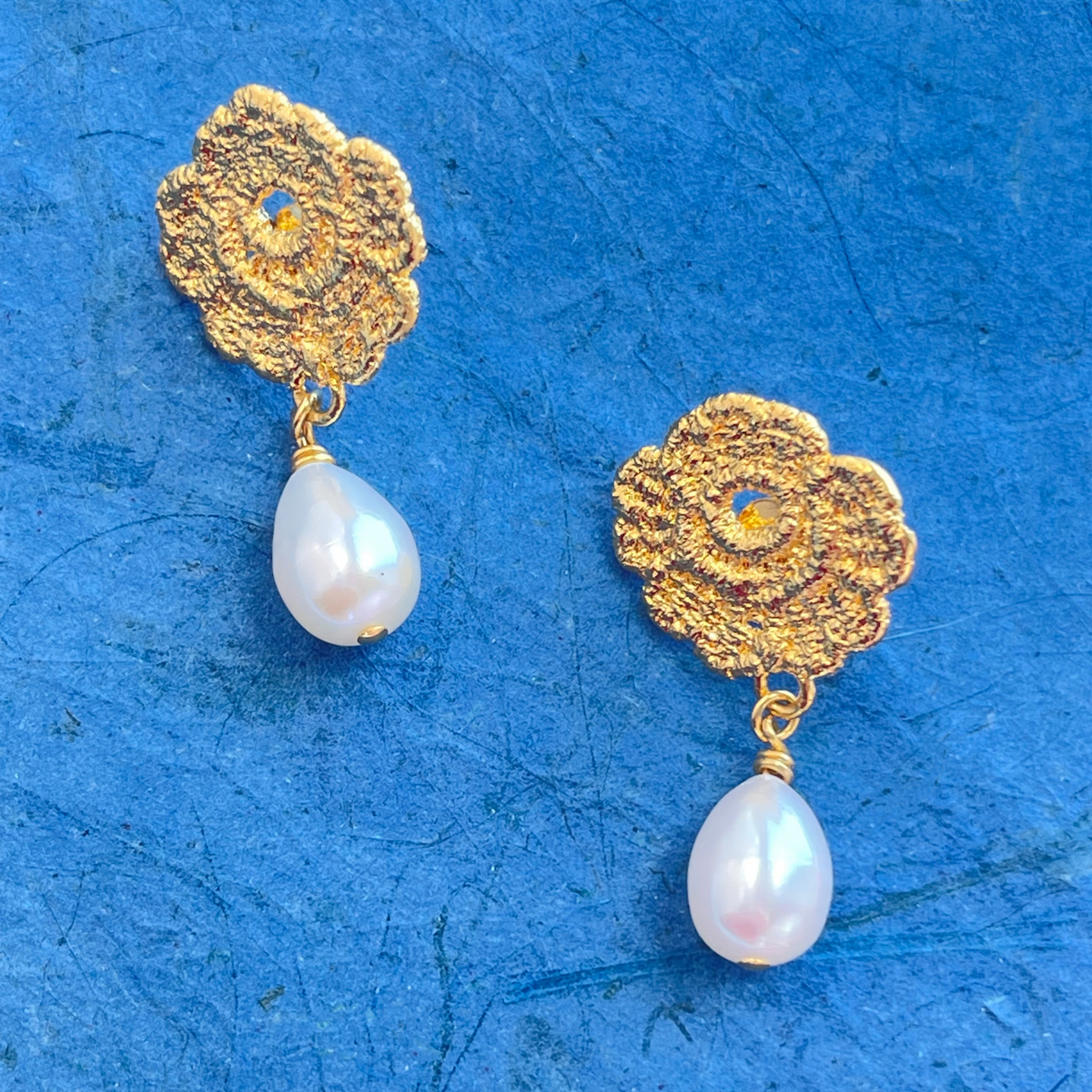 Lace rose pearl drop earrings in 24k gold.